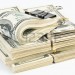 7327131-many-bundle-of-us-100-dollars-bank-notes-isolated-on-white-background