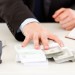 closeup-business-mans-hand-giving-260nw-70585102_1
