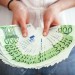 27307095-Business-woman-showing-a-spread-of-euro-cash-made-of-several--Stock-Photo
